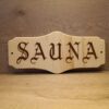 Sauna_isokylttihevi Ovikyltti Sauna 34x15 cm gootti